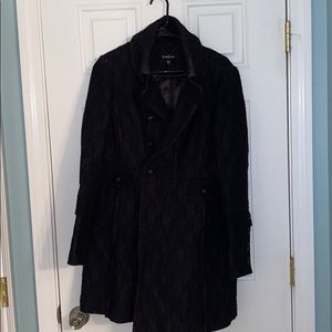 BEBE black trench coat with floral fabric